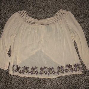 Cream top with purple and green pattern